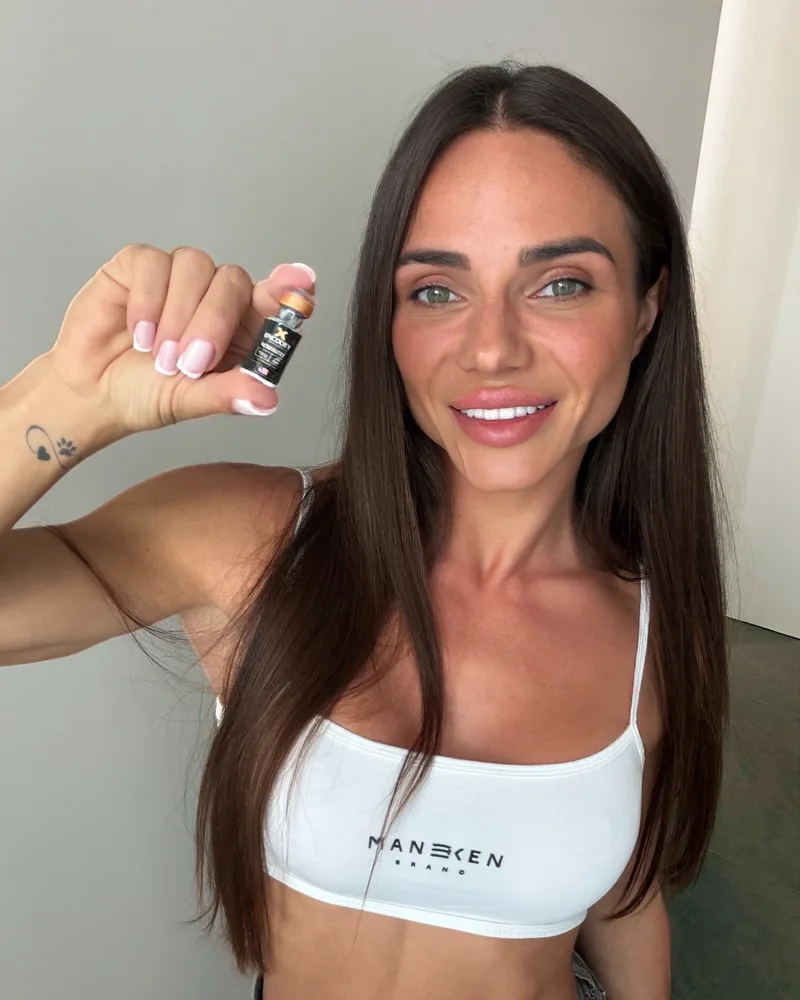 Anna holding an ENCODEX product